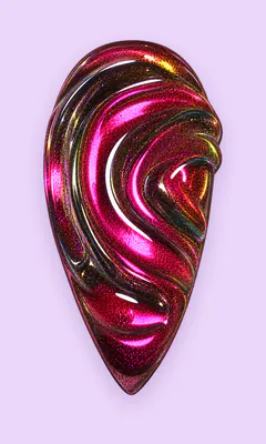 Uña con remolino magenta cat eye en relieve.